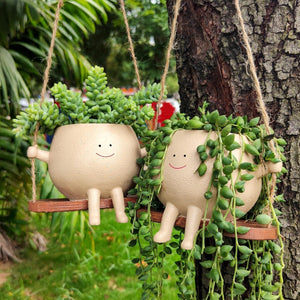 Hanging swing face planter pot made of durable resin