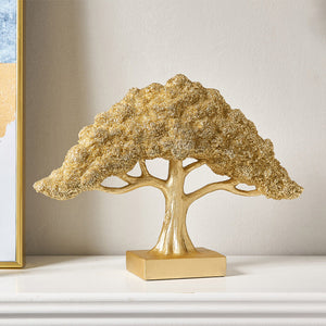 Gold abstract tree ornament symbolizing prosperity and growth
